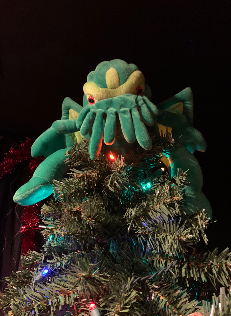 Small Cthulhu plush used as a Christmas tree topper.